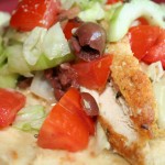Falafel crusted chicken breast grilled and served on a warm pita