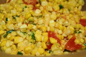 Sweet corn salad with tomato and green onions sauteed in butter